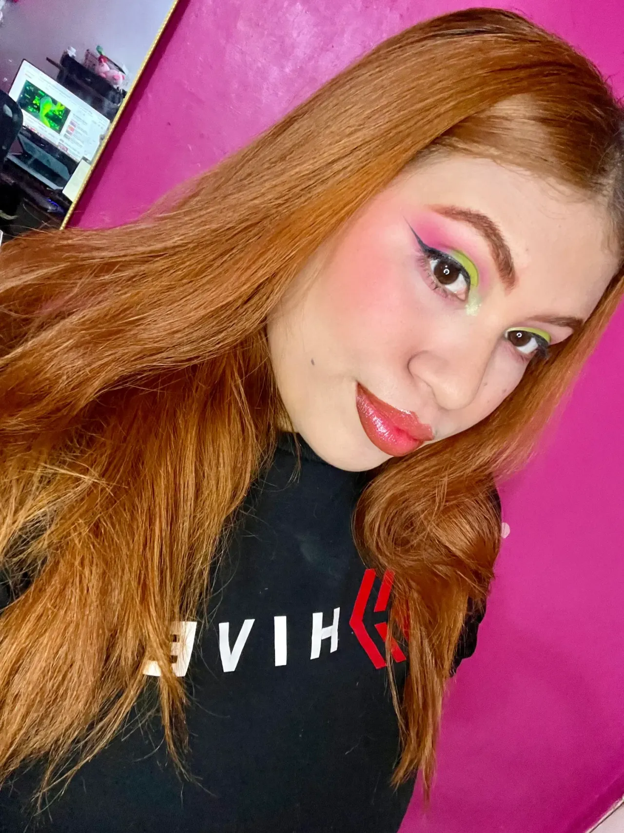 Pink makeup with green cut crease