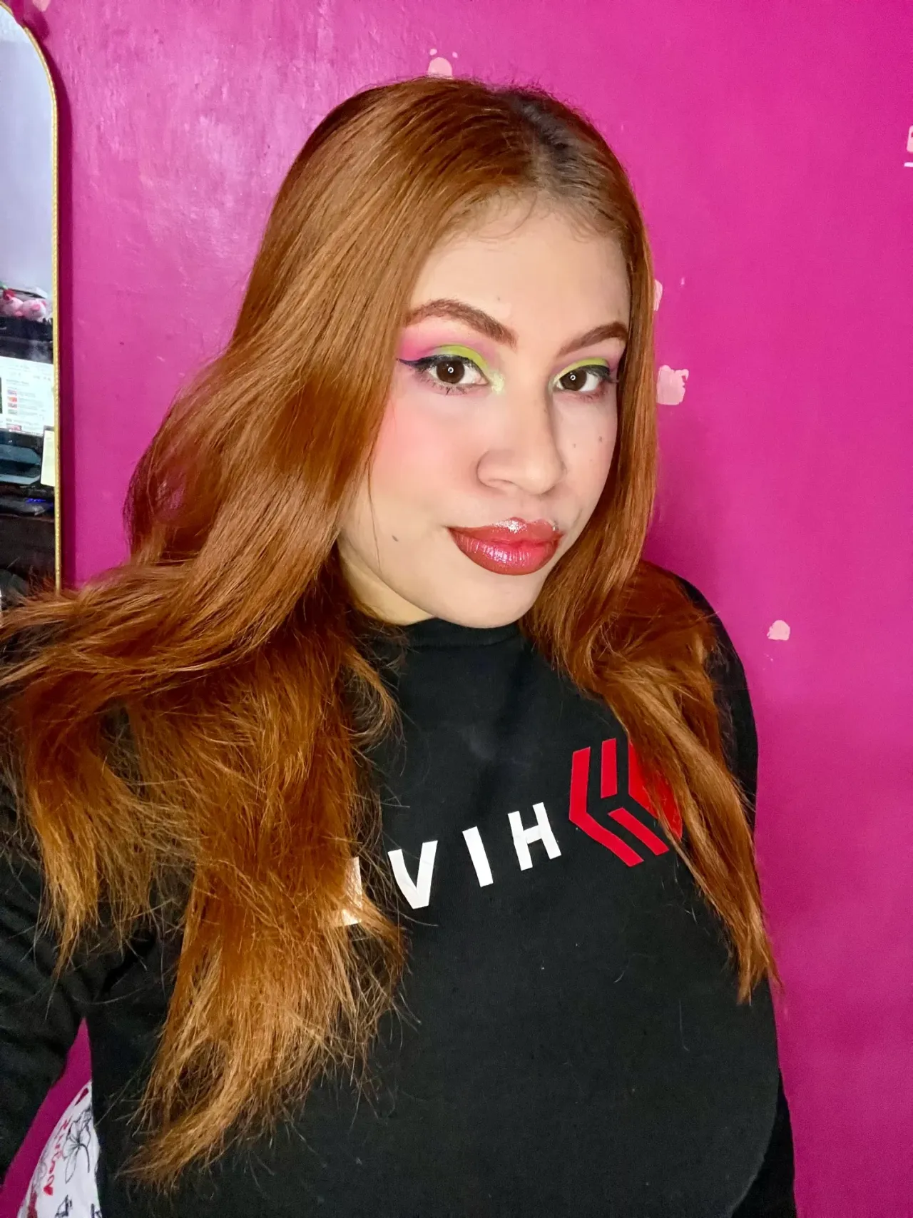 Pink makeup with green cut crease