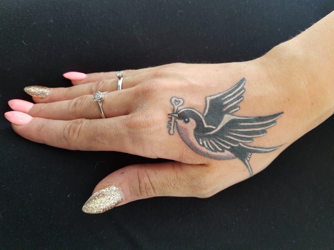 Hand Swallow tattoo women at theYoucom