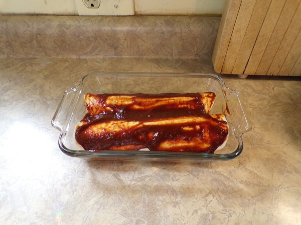 https://cdn.steemitimages.com/DQmWJvYquXzAoFcCkejHPjHjsnQMaixC3hpiZgMkwfHsBdT/Enchiladas%20-%20sauce%20on%20wheat%20tortillas%20crop%20January%202020.jpg