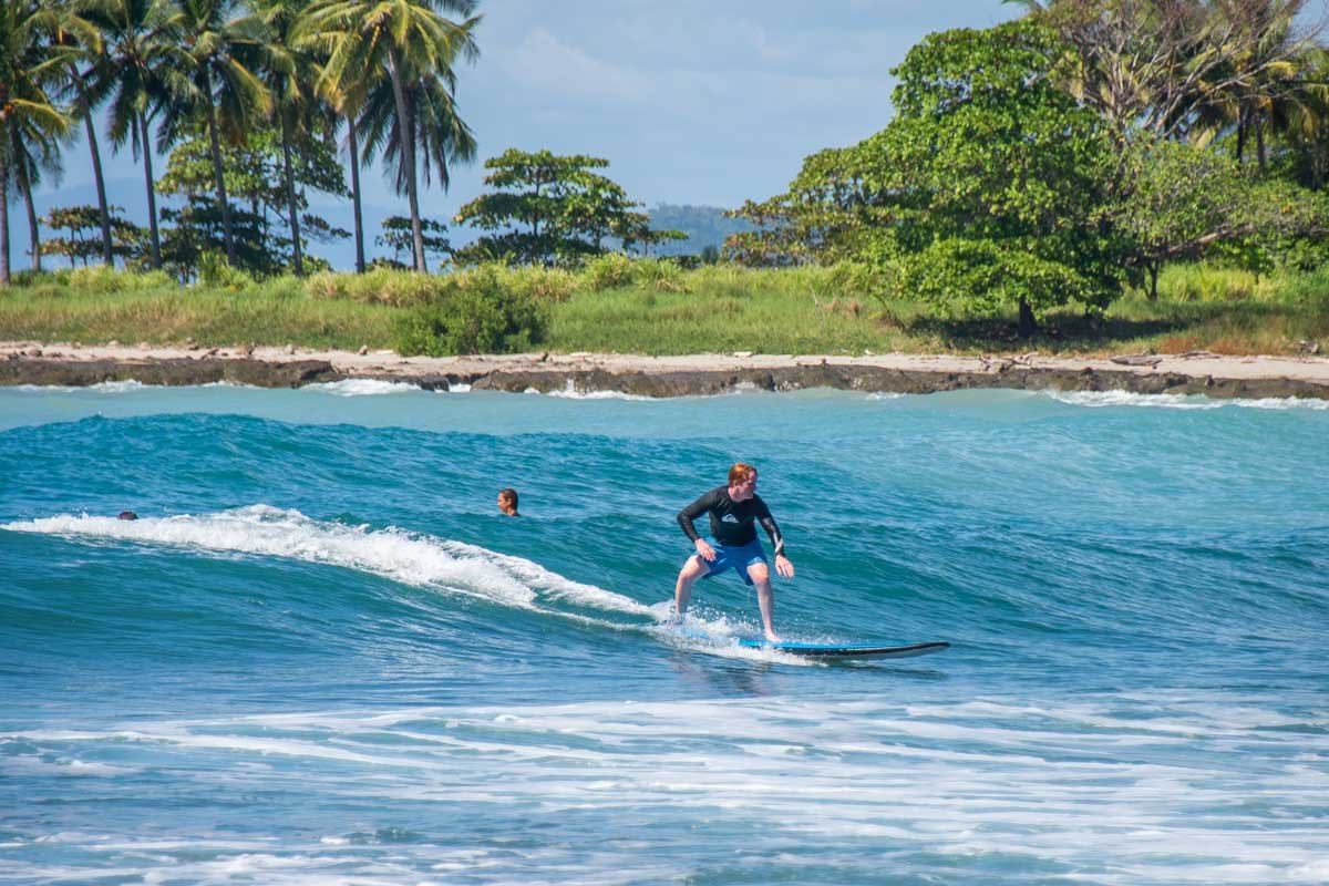 https://costaricatravellife.com/wp-content/uploads/2022/01/Surfing-at-a-beach-near-Santa-Teresa-Costa-Rica.jpg