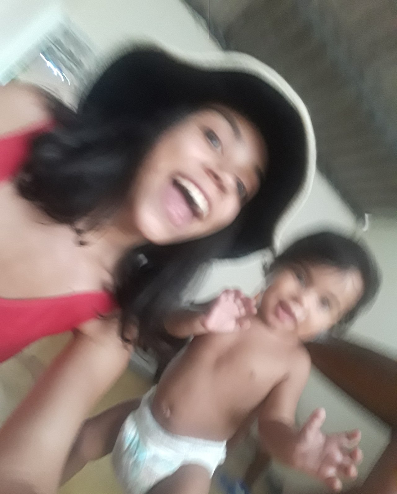 Blurry pic of @neyxirncn and baby Sayri having fun.