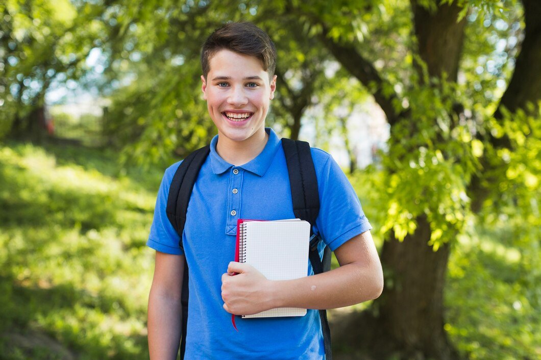 smiling-teen-boy-with-notebooks_23-2147668969.jpg