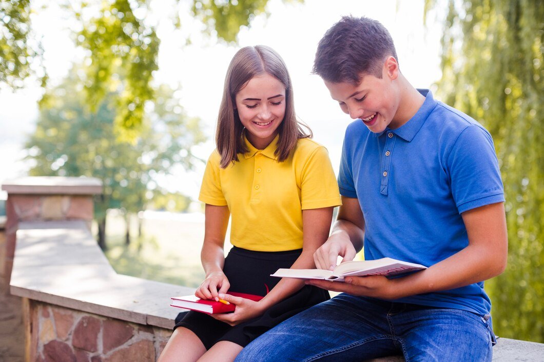 teens-reading-books-park_23-2147668951.jpg