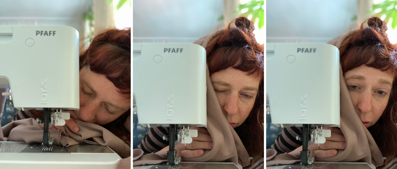 A woman glimpsing sleepily over her sewing machine