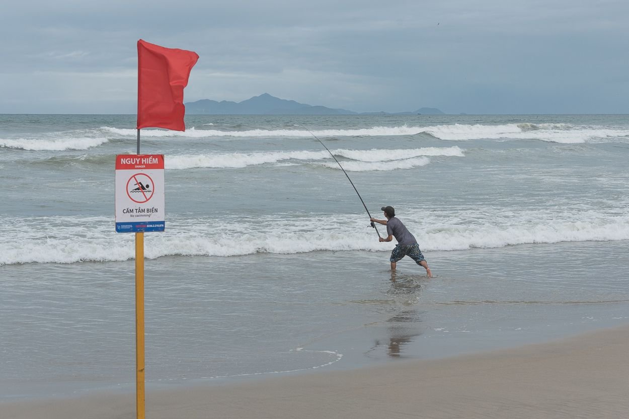 Surf Fishing, Vacationers, and Charming Waves at Da Nang Beach in