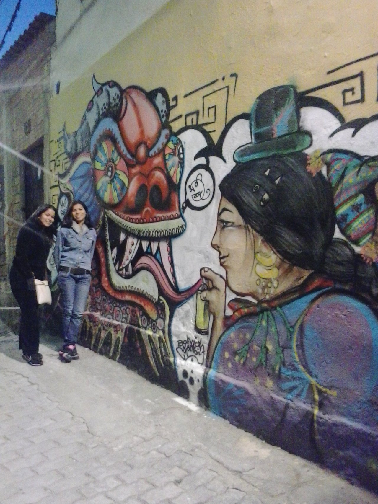 Mural of a typical Bolivian woman in a street in the historic center of La Paz