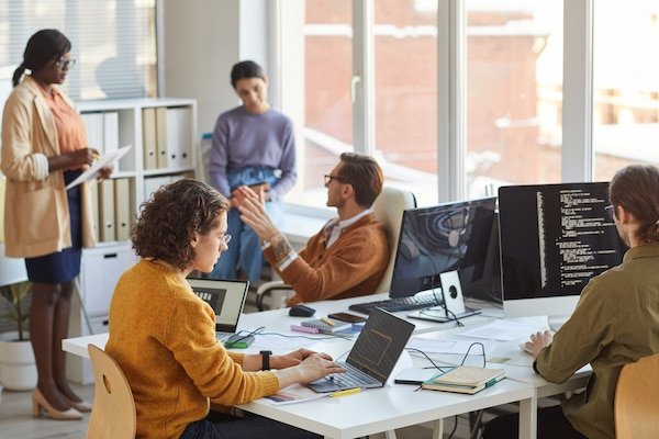 https://img.freepik.com/premium-photo/diverse-team-young-software-programmers-using-computers-writing-code-while-collaborating-project-it-development-studio-copy-space_236854-29533.jpg?w=600