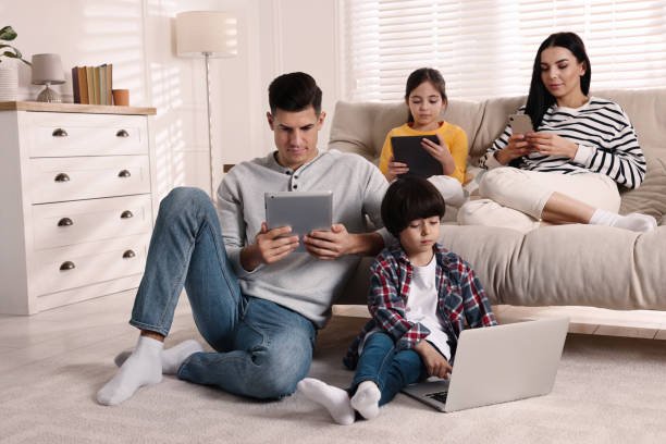 https://img.inleo.io/DQmTVNEhbd3pW1e5JtWsTRVXrSqsUbcrWucHhQxVHjaQAU8/internet-addiction-family-with-different-gadgets-in-living-room.jpg