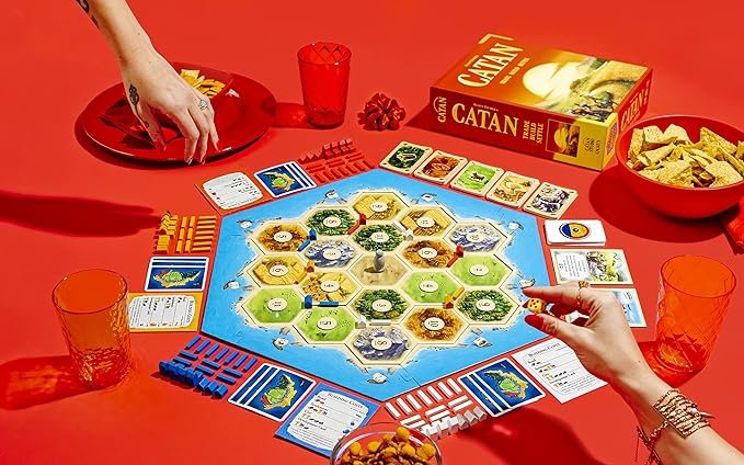 2 Catan (Base Edition) - Engaging Board Game for Players aged 10+ | Suitable for both Adults and Families | Ideal for 3-4 Participants | Average Duration of Play: 60 Minutes | Developed by Catan Studio.