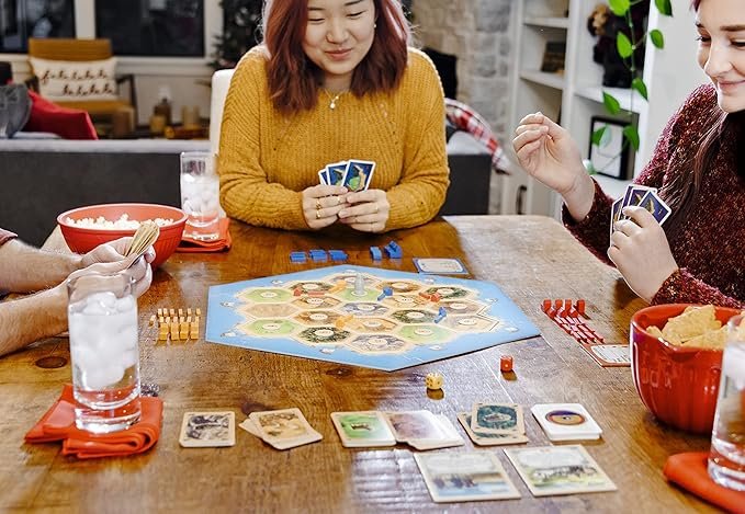 6 Catan (Base Edition) - Engaging Board Game for Players aged 10+ | Suitable for both Adults and Families | Ideal for 3-4 Participants | Average Duration of Play: 60 Minutes | Developed by Catan Studio.