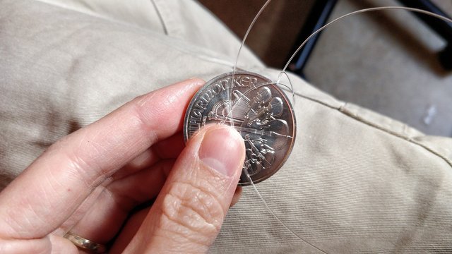 Testing two suspect silver coins (aka How to tie a string around a coin!)