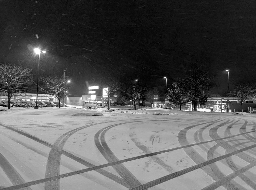 13 February 2022 - Empty snowy urban parking lot on  a Sunday night — Hive