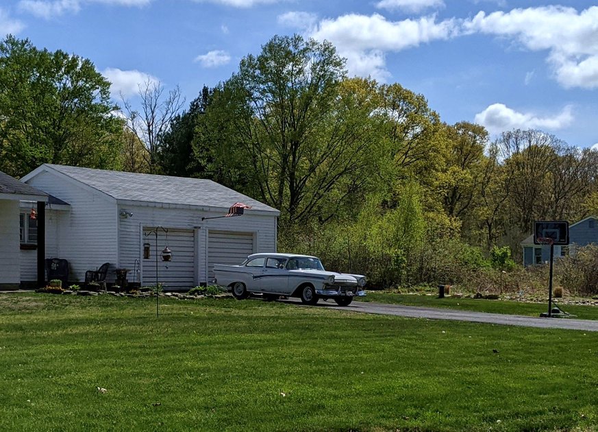 12 May 2022 - Antique car in a driveway — Hive