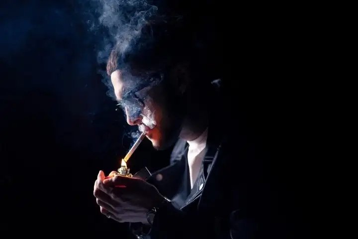 Man lighting a cigarette