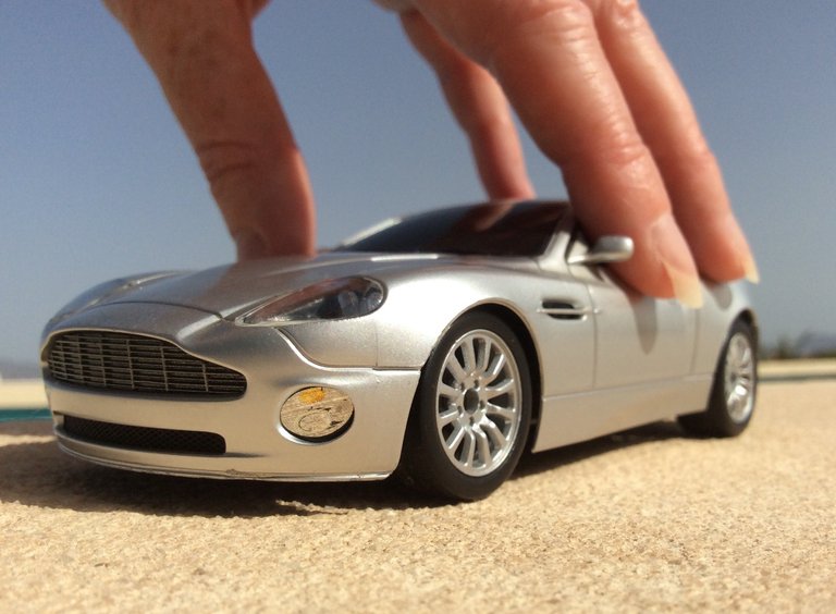 aston martin vanquish with hand