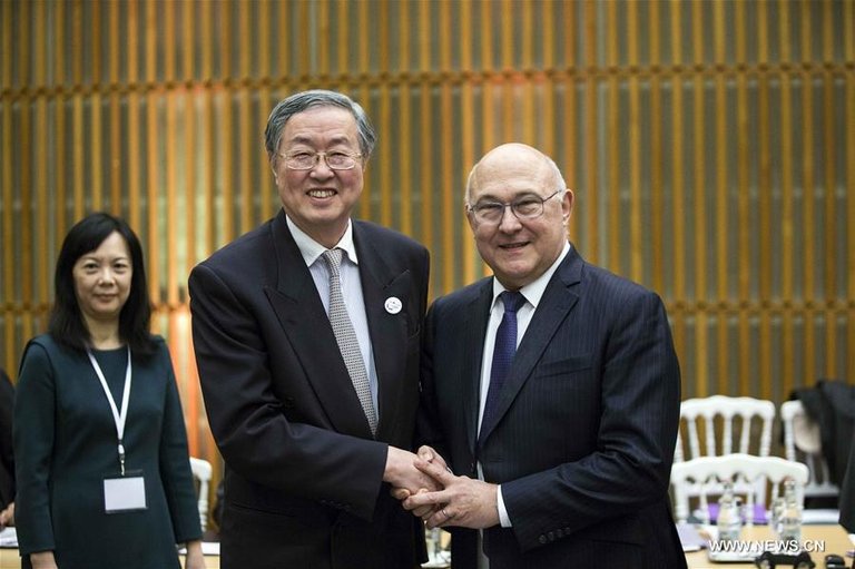 Zhou Xiachuan pictured w/French Finance Minister Michel Sapin, vowing to broaden SDR use earlier this year - via Xinhua