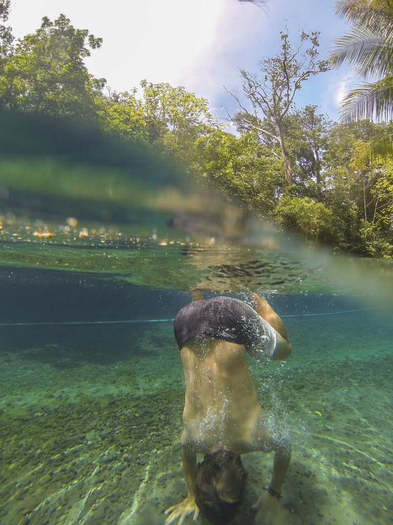 Me setting up for a handstand in the clear water