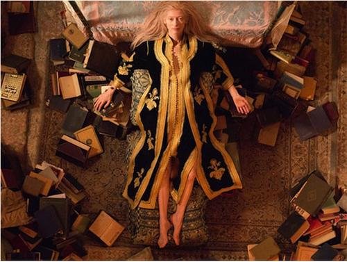 Eve, played by TildaSwinton, packs books for the trip