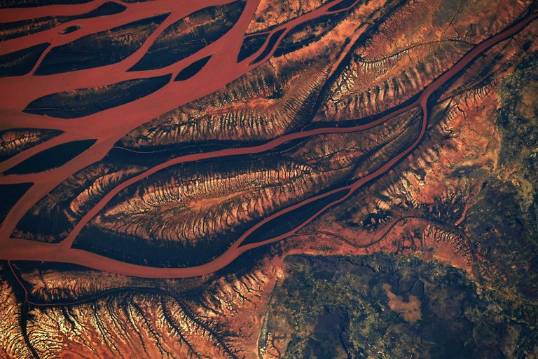 As the International Space Station flew overhead, NASA astronaut Ricky Arnold captured this photograph of a changing landscape in the heart of Madagascar, observing drainage into the sea in the Betsiboka Estuary due to decimation of rainforests and coastal mangroves.