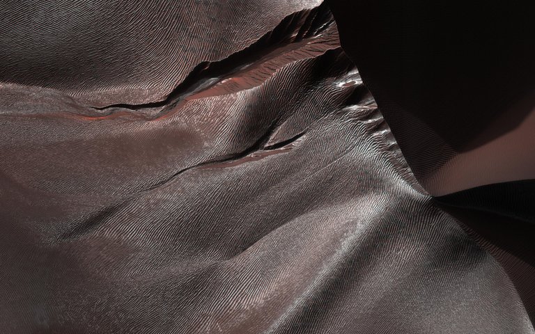 Gullies on Martian sand dunes, like these in Matara Crater, have been very active, with many flows in the last ten years.