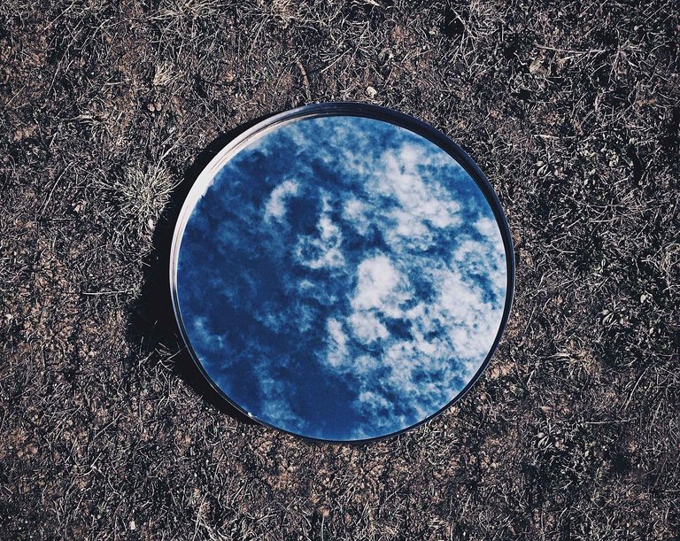 Image from: [http://maxpixel.freegreatpicture.com/Blue-Ground-Mirror-Grass-Reflection-Sky-Clouds-925209](http://maxpixel.freegreatpicture.com/Blue-Ground-Mirror-Grass-Reflection-Sky-Clouds-925209)