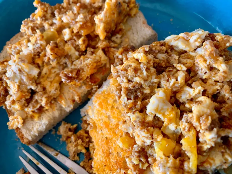 clrnvpw56007jywszc9jj4b9r_Chorizo_egg_onion_on_homemade_italian_bread.webp