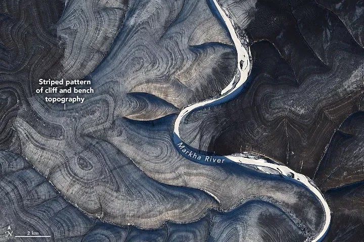 Scientists can't agree on why these hills in the Russian Arctic ripple with stripes.