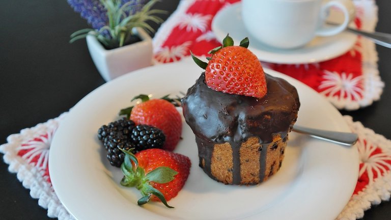 Small chocolate cakes and strawberries. Photo by RitaE