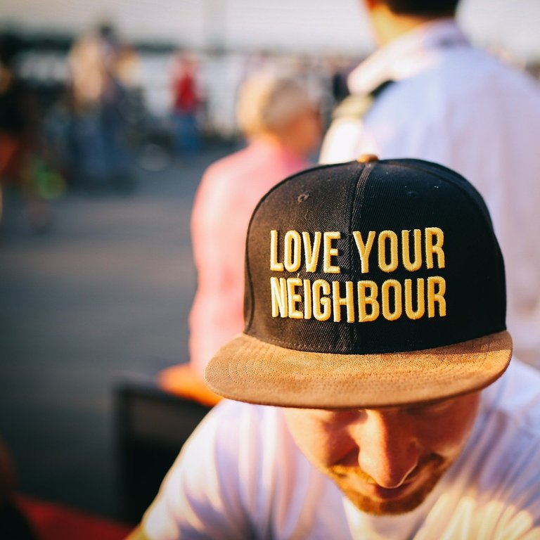 Not Too Close, Not Too Distant: The Neighborly Balance