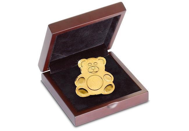 teddy-bear-shaped-gold-coin-in-display-case.jpeg