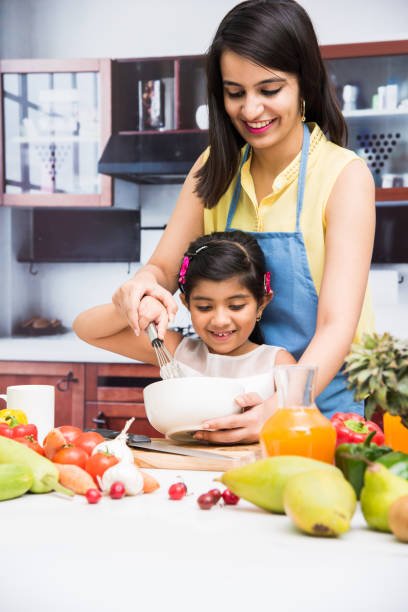 indian-mother-and-child-in-kitchen-picture-id698530792.jpg