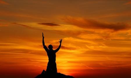 65222679-silhouette-of-a-man-praying-at-sunset-concept-of-religion.jpg