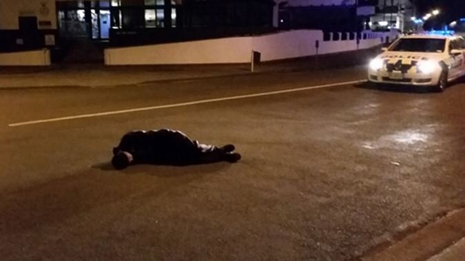 drunk-man-asleep-on-road-nz-police.jpg