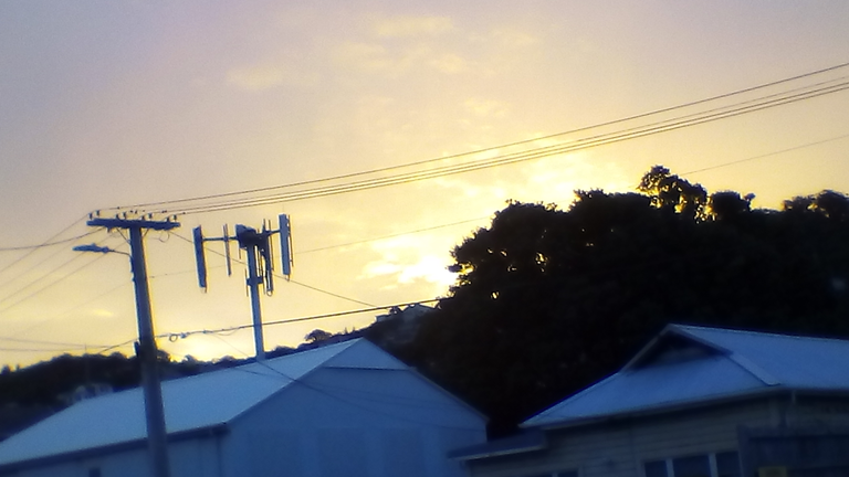 SunSettingThroughApproachingColdFront6November2019Kilbirne.png