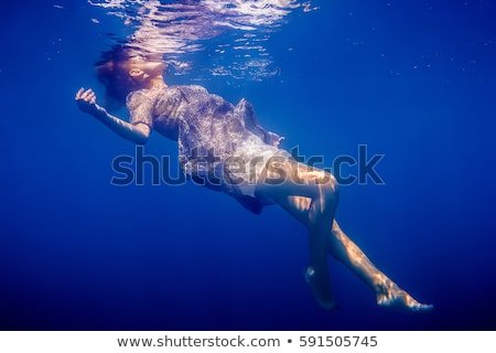 beautiful-girl-dress-underwater-ocean-450w-591505745.jpg