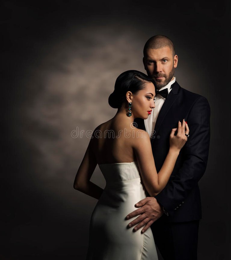 couple-black-suit-white-dress-rich-man-fashion-woman-gray-background-65521745.jpg