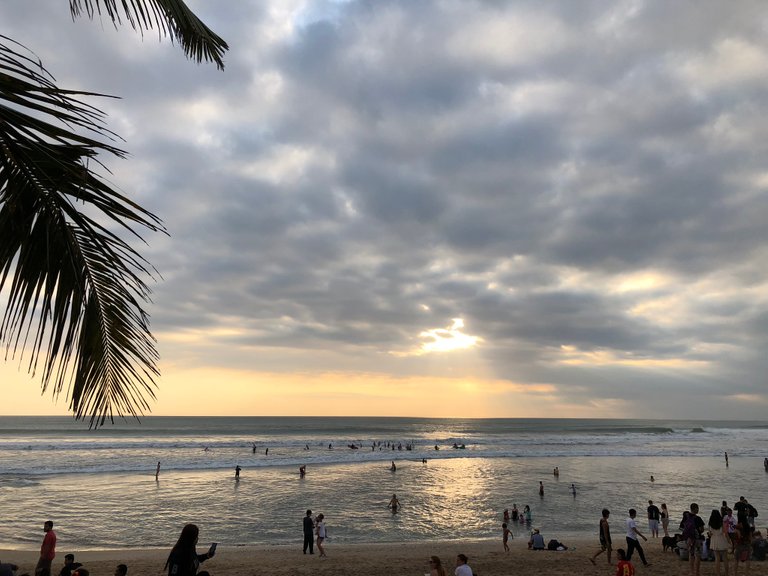 Sunset at the beach with people.jpeg