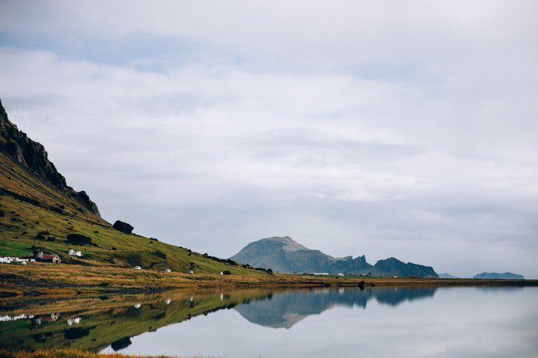 glassy-iceland-lake-water-reflects-hillside_4460x4460.jpg