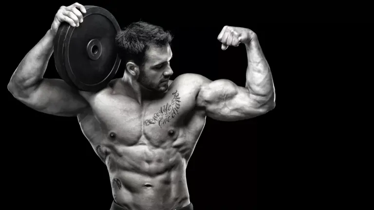 bodybuilder-bicep-flex-holiday-workout.webp