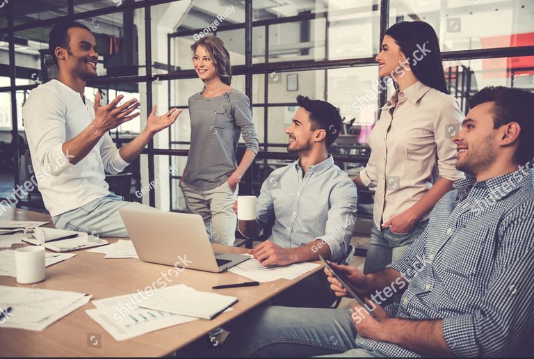 stock-photo-beautiful-business-people-are-using-gadgets-talking-and-smiling-during-the-conference-in-office-598993493~2.jpg