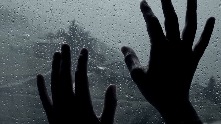 closeup-of-hands-in-front-of-rain-concept-of-sadness_n1rnaddhg__F0000.png