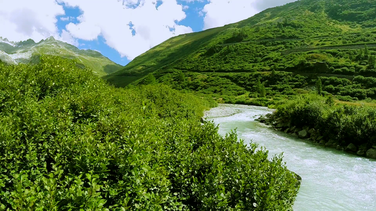 aerial-view-of-epic-mountain-river-landscape-scenery-peaceful-nature-background_bv9h5nui__F0000.png