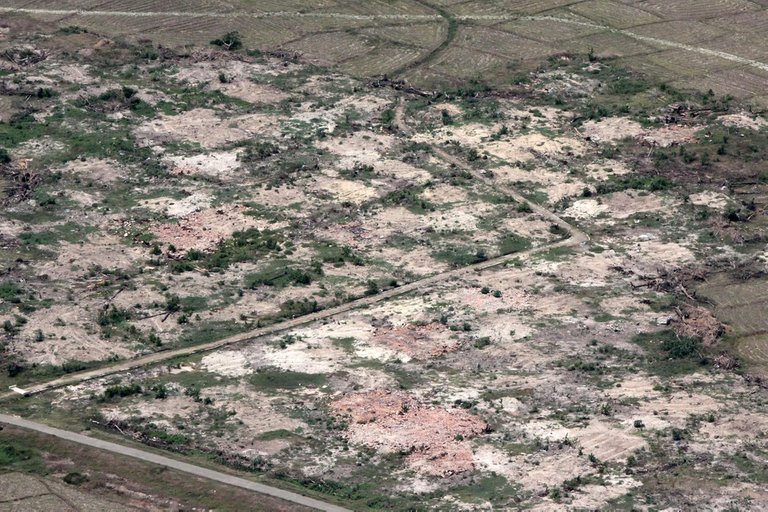 FILE-PHOTO-An-aerial-view-shows-burned-down-villages-once-inhabited-by-the-Rohingya-seen-from-the-Myanmar-military-helicopters-that-carried-the-U-N-envoys-to-northern-Rakhine-state-Myanmar.jpg