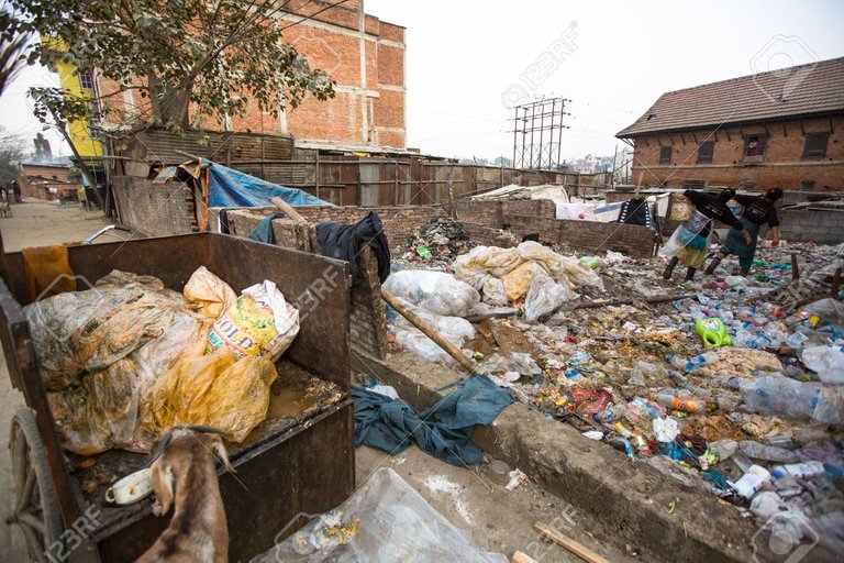 28360979-kathmandu-nepal-dec-19-unidentified-people-from-poorer-areas-working-in-sorting-of-plastic-on-the-du.jpg