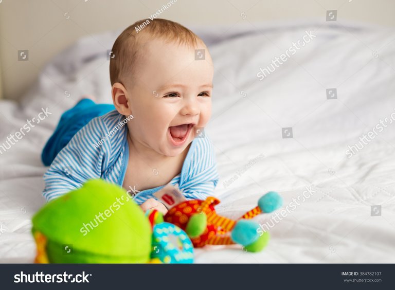 stock-photo-little-baby-laughs-384782107.jpg