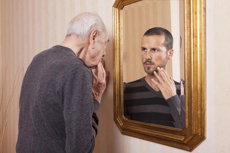 old-man-looking-at-younger-reflection.jpg