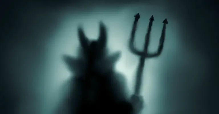 6682-dark-silhouette-of-devil-figure-with-pitchfor.webp