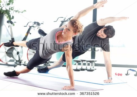 stock-photo-portrait-of-a-man-and-a-woman-doing-plank-exercises-at-the-fitness-center-367351526.jpg