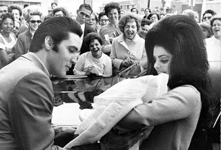 Elvis_Presley_and_Priscilla_with_Lisa_Marie_February_1968.jpg
